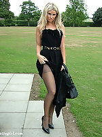 Beautiful blonde lady dressed in black pantyhose and showing off her high heels